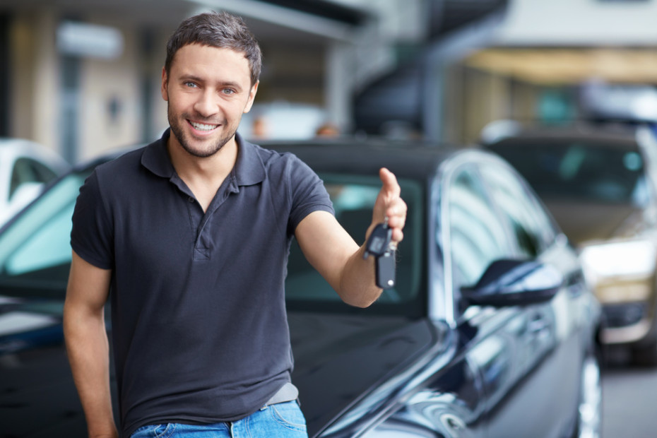 man holding car keys